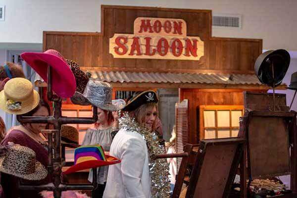 Rustic western saloon wedding photo booth sign.