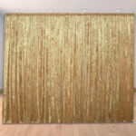 Gold fabric solid color draped wedding and party backdrop Gold fabric solid color draped wedding and party backdrop