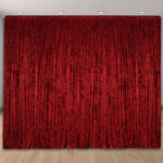 Red fabric solid color draped wedding and party backdrop. Red fabric solid color draped wedding and party backdrop.