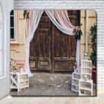 Wooden rustic doors with white draped valance photo booth backdrop Wooden rustic doors with white draped valance photo booth backdrop